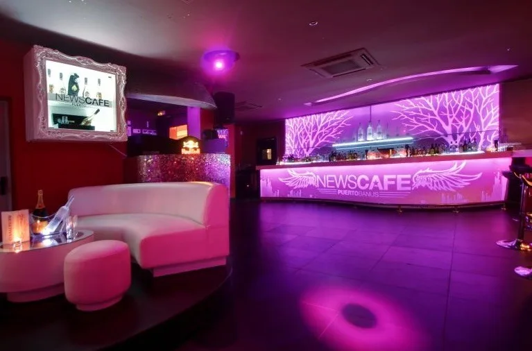 Front-line marina restaurant terrace Puerto Banus with superyachts moored alongside