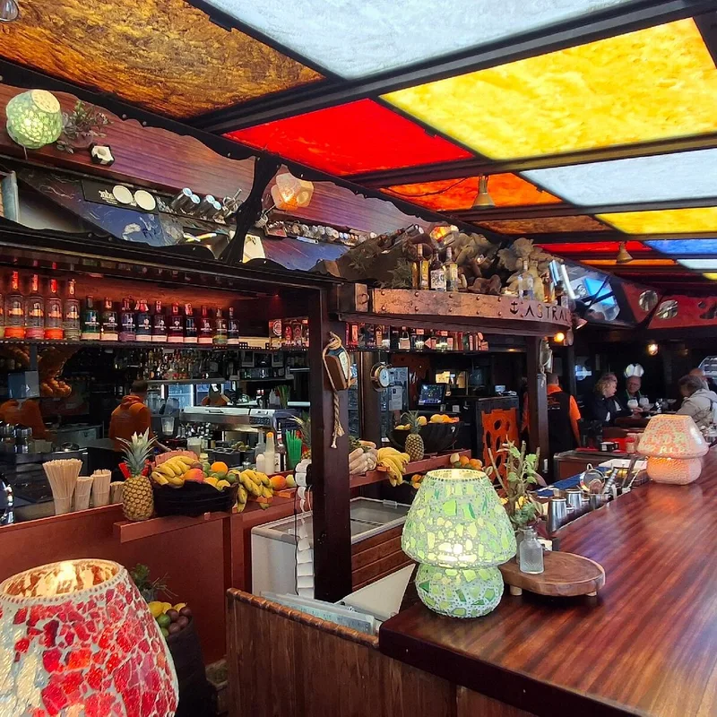 Astral Cocktail Bar Puerto Banus wooden galleon structure at dusk