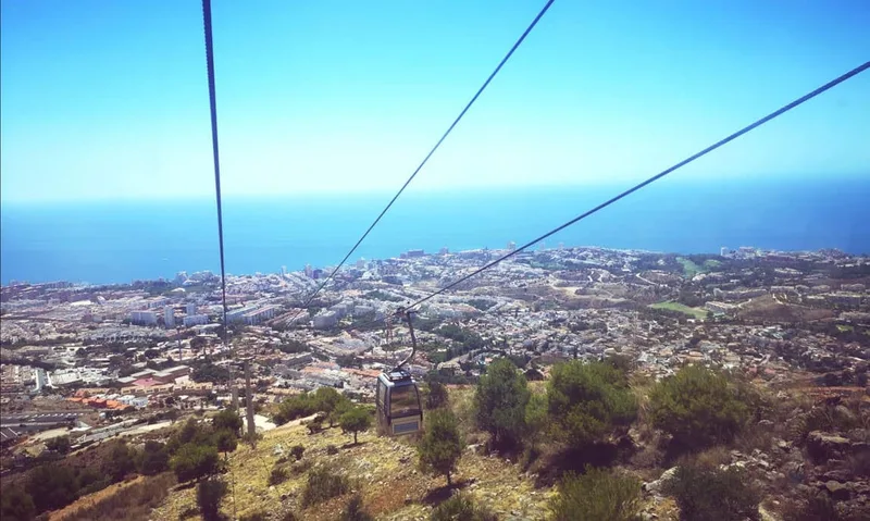 View from Benalmadena cable car gondola looking down over Puerto Marina, the Costa del Sol coastline and Mediterranean sea